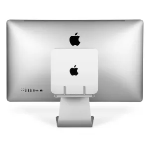 Twelve South BackPack 3-hylla monterad bakom en iMac-skärm, med synliga stödstolpar och ett silverfärgat stativ.
