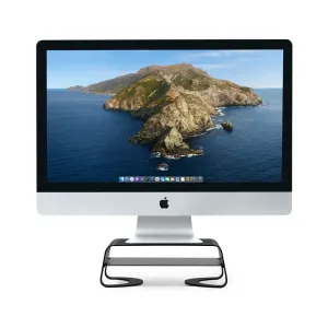 Apple iMac mustalla Twelve South Curve Riser -näyttötelineellä, jossa on rei’itetty hylly