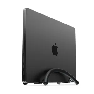 Twelve South BookArc Flex vertical laptop stand holding a black MacBook upright on a desk