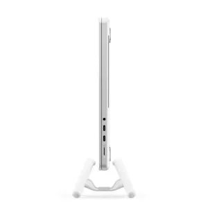 Twelve South BookArc Flex white vertical laptop stand holding a MacBook upright to save desk space