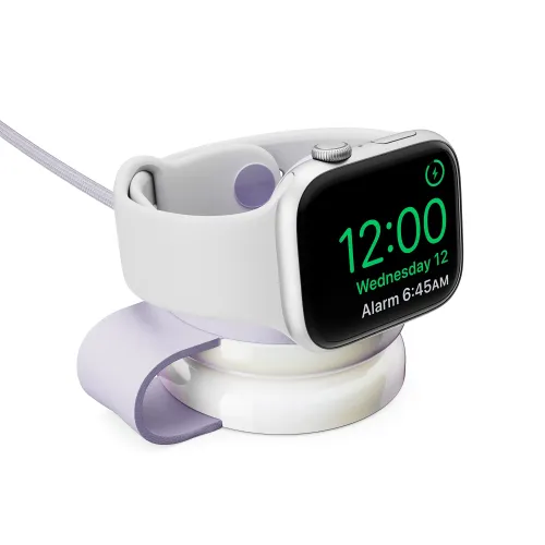 Twelve South ButterFly SE-laddare i rund puckform med uppfälld flik som stöd, laddar en Apple Watch; flätad USB‑C-kabel syns.