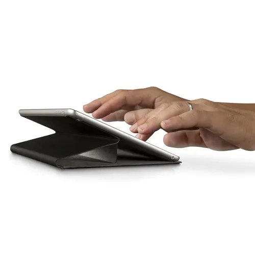 Leather case for iPad with foldable cover forms triangle support at a low angle; tablet in landscape, hands write on screen.