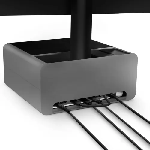 iMac-stativ i gunmetal med öppet fack och rundade hörn, frontslits med flera anslutna kablar och skärmens stativ genom mitten sedd framifrån.